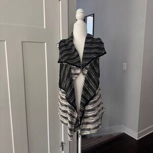 Urban Outfitters’ size small striped black and white vest